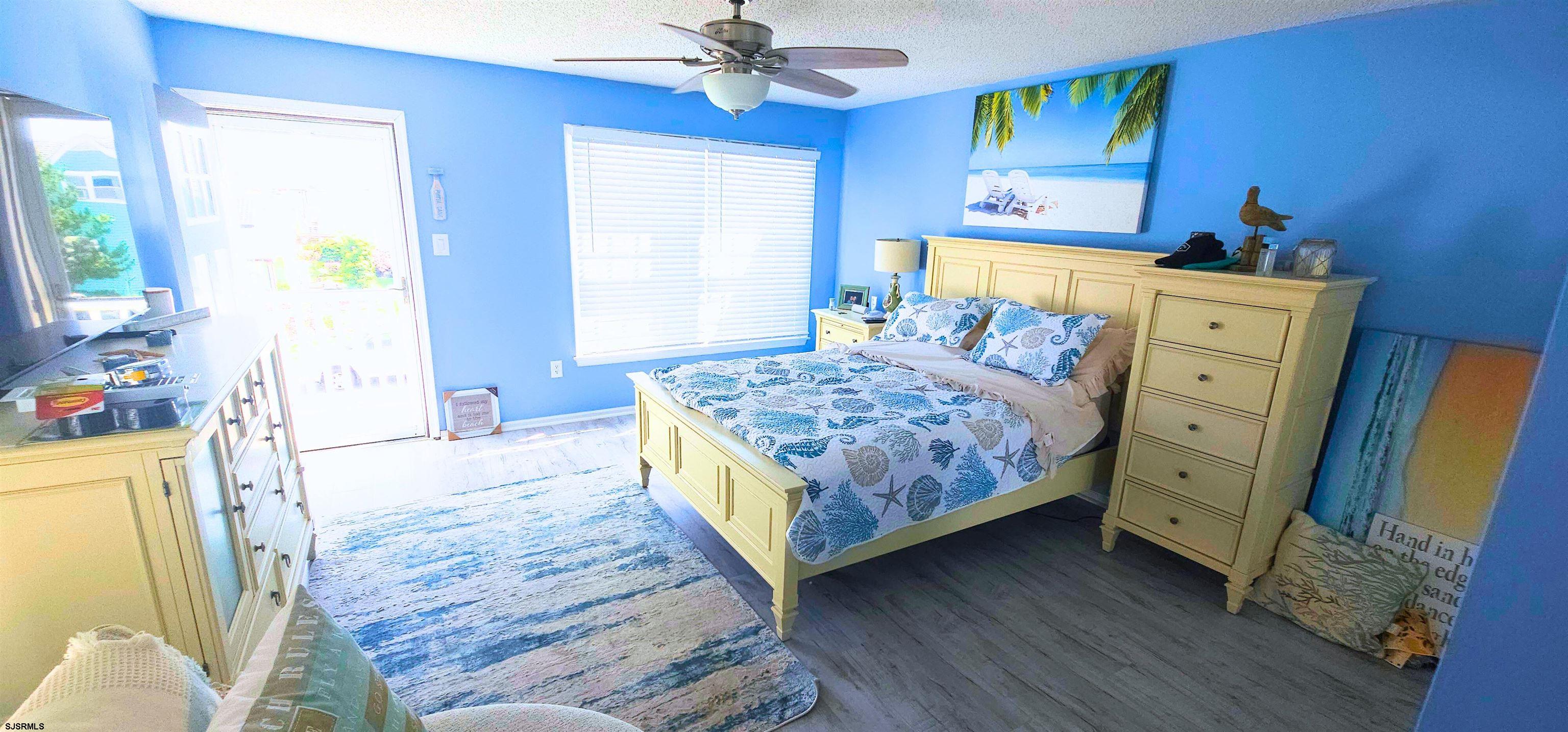 322 38th Street South, Unit B Brigantine, NJ 08203 - Photo 8 of 21 a bedroom with a bed and a dresser