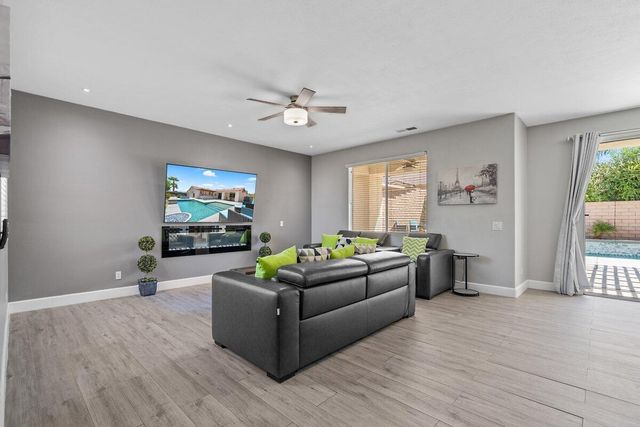 a room with furniture and a wooden floor