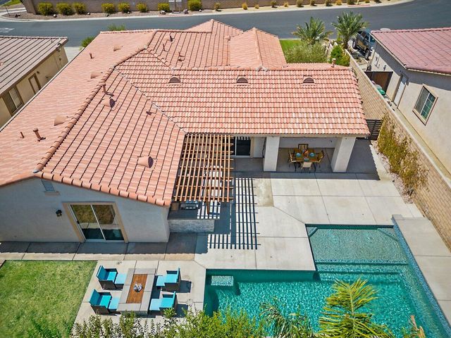 a view of a white building with many windows