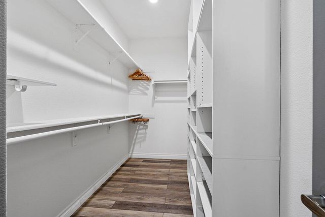 a bathroom with double vanity sink and a mirror