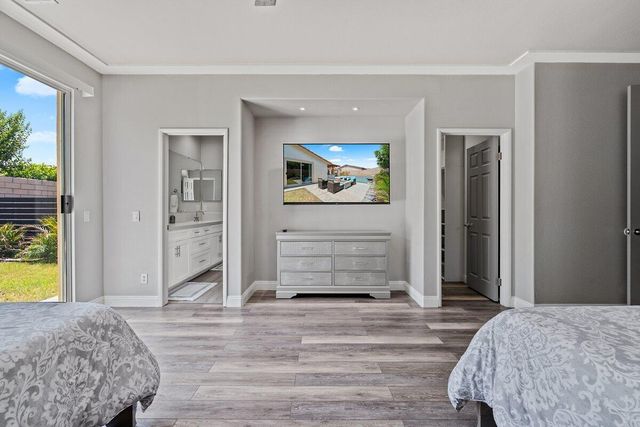 a bathroom with a double vanity sink mirror and shower