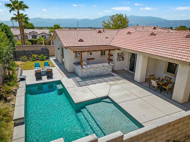 an aerial view of a house with a garden