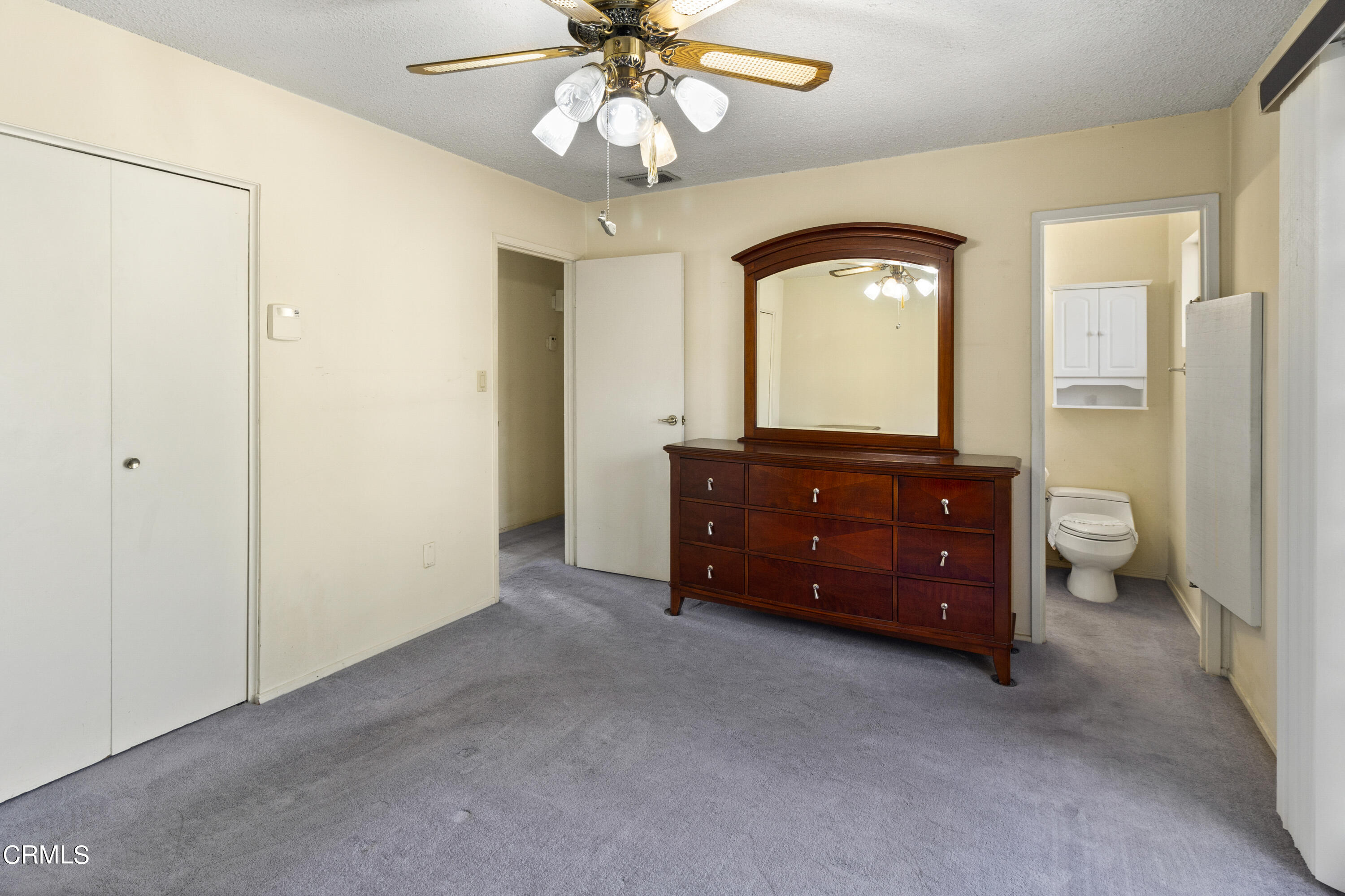 445 Rutgers Drive Santa Maria, CA 93455 - Photo 14 of 21 a spacious bedroom with a bed and a chandelier