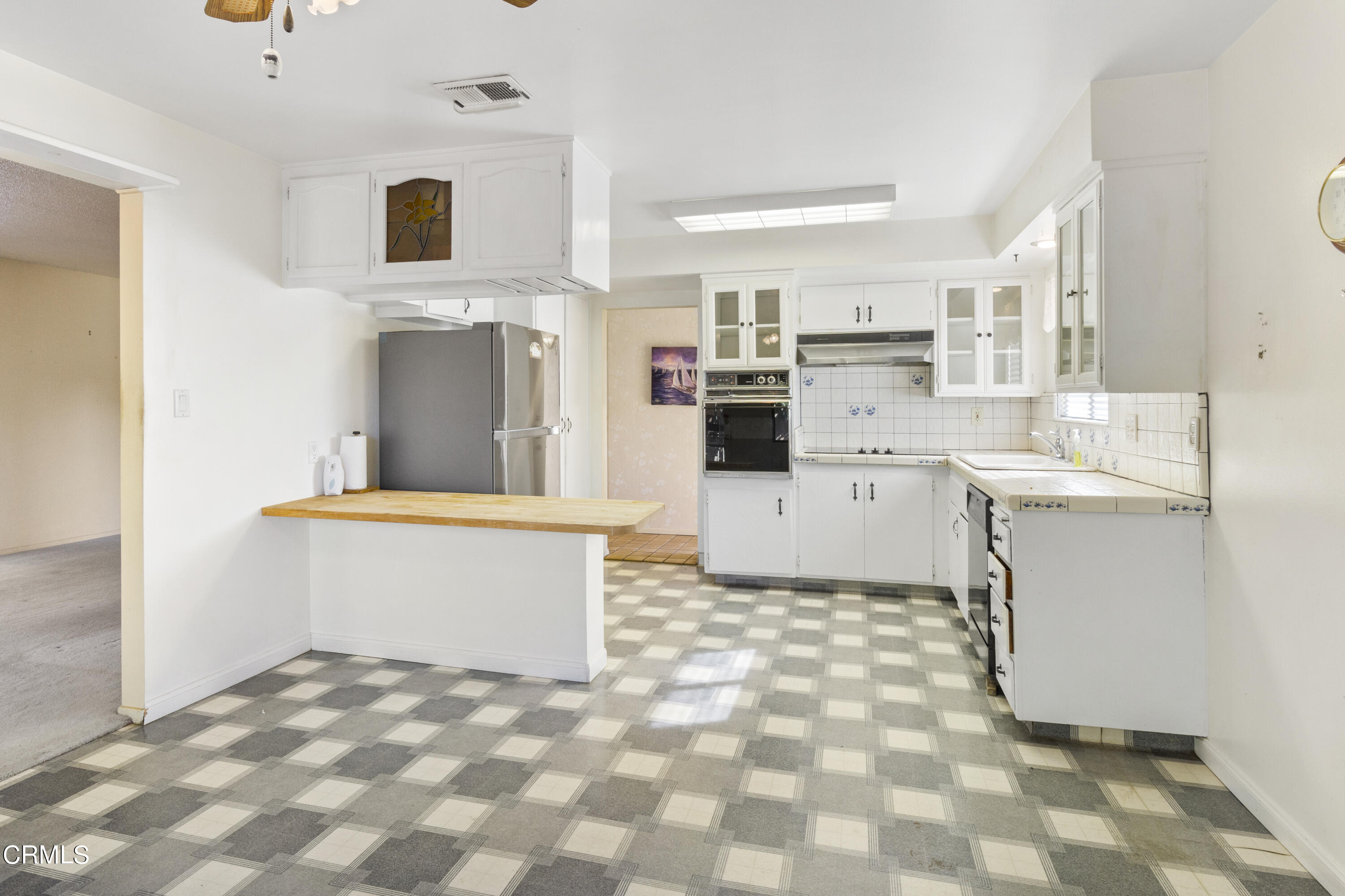 445 Rutgers Drive Santa Maria, CA 93455 - Photo 6 of 21 a view of kitchen with sink microwave and refrigerator