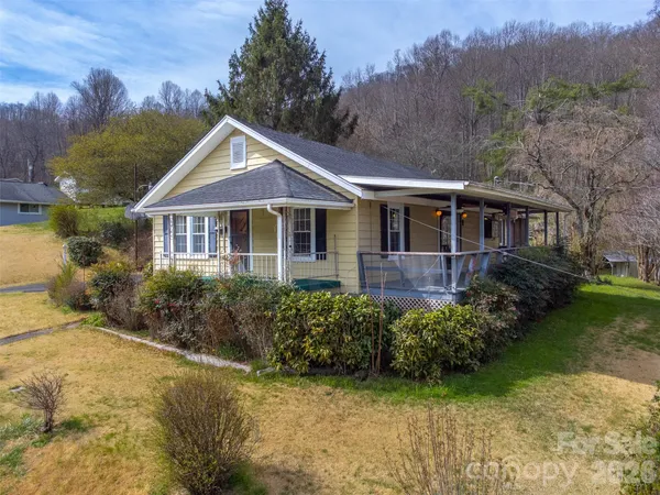 a house with trees in the background