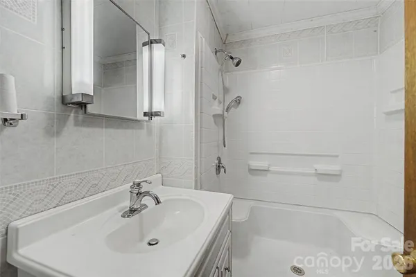 a bathroom with a sink and shower