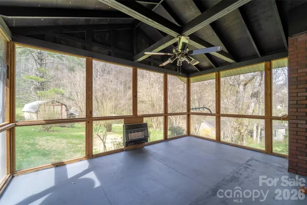 a view of an empty room with a large window