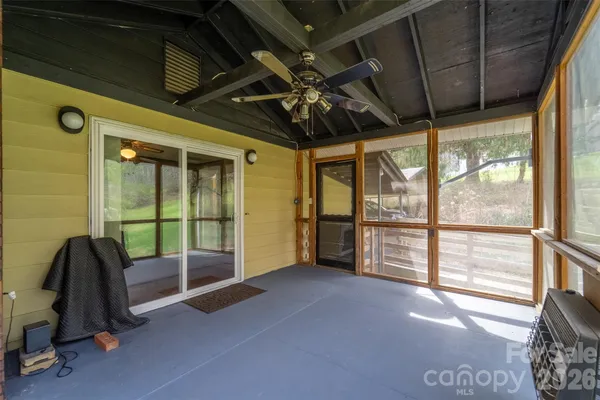 a view of empty room with windows