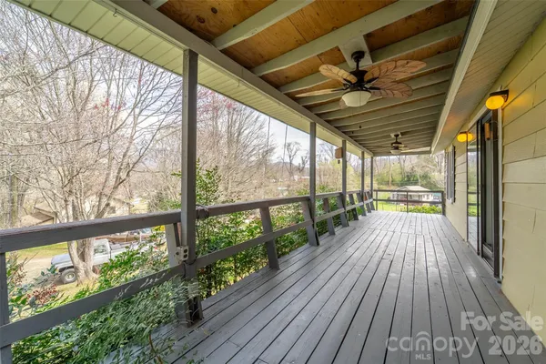 a view of balcony with wooden floor