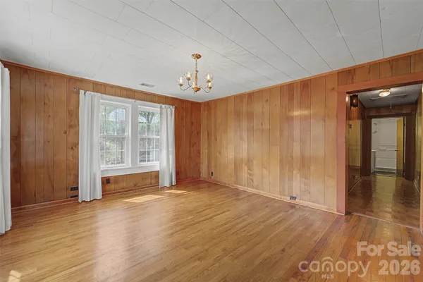 a view of an empty room with glass door