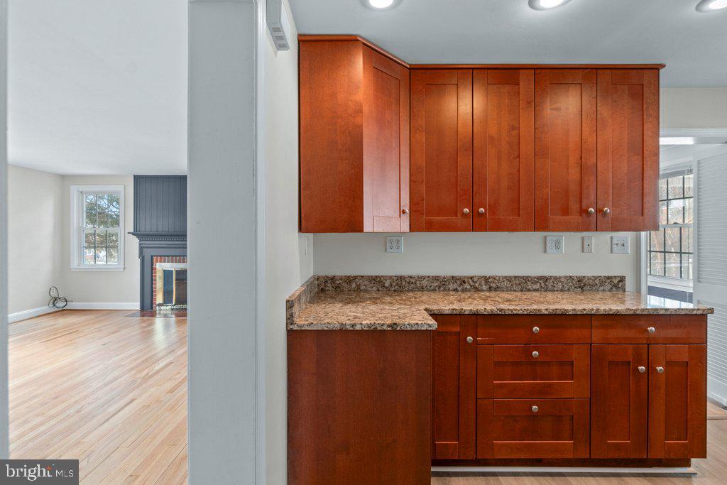 1522 Doxbury Road Baltimore, MD 21286 - Photo 11 of 28 an empty room with wooden floor and cabinet