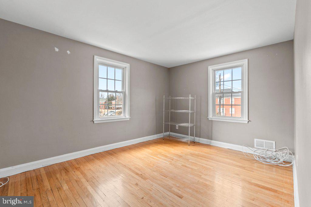 1522 Doxbury Road Baltimore, MD 21286 - Photo 14 of 28 a view of empty room with wooden floor and fan