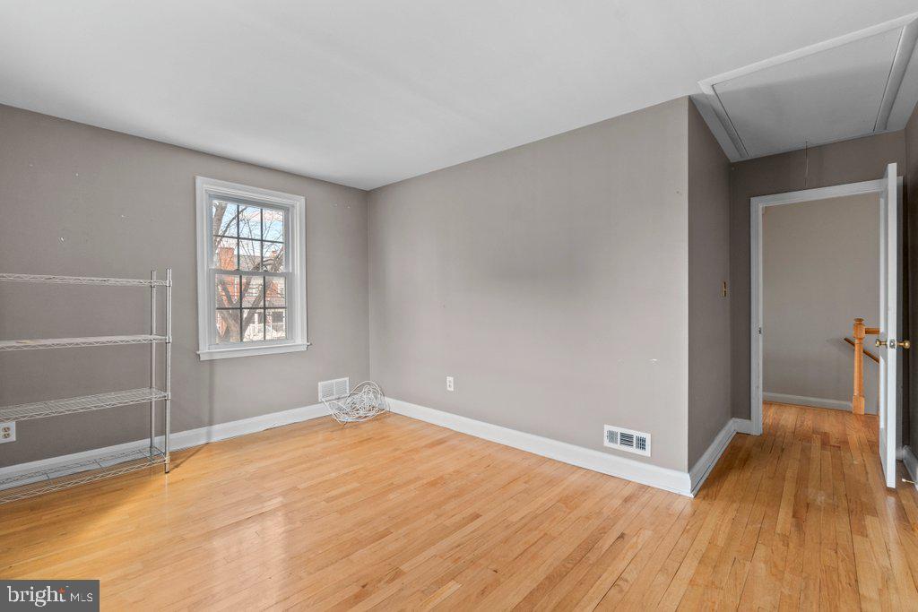 1522 Doxbury Road Baltimore, MD 21286 - Photo 15 of 28 a view of empty room with wooden floor and fan