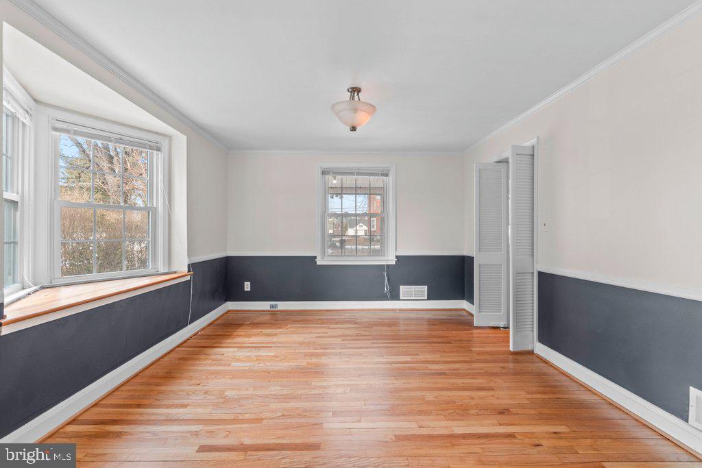 1522 Doxbury Road Baltimore, MD 21286 - Photo 7 of 28 a view of a livingroom with wooden floor and a window