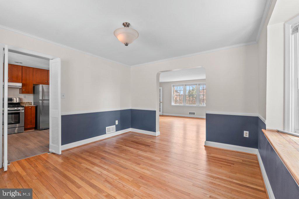 1522 Doxbury Road Baltimore, MD 21286 - Photo 8 of 28 a bedroom with wooden floor and window