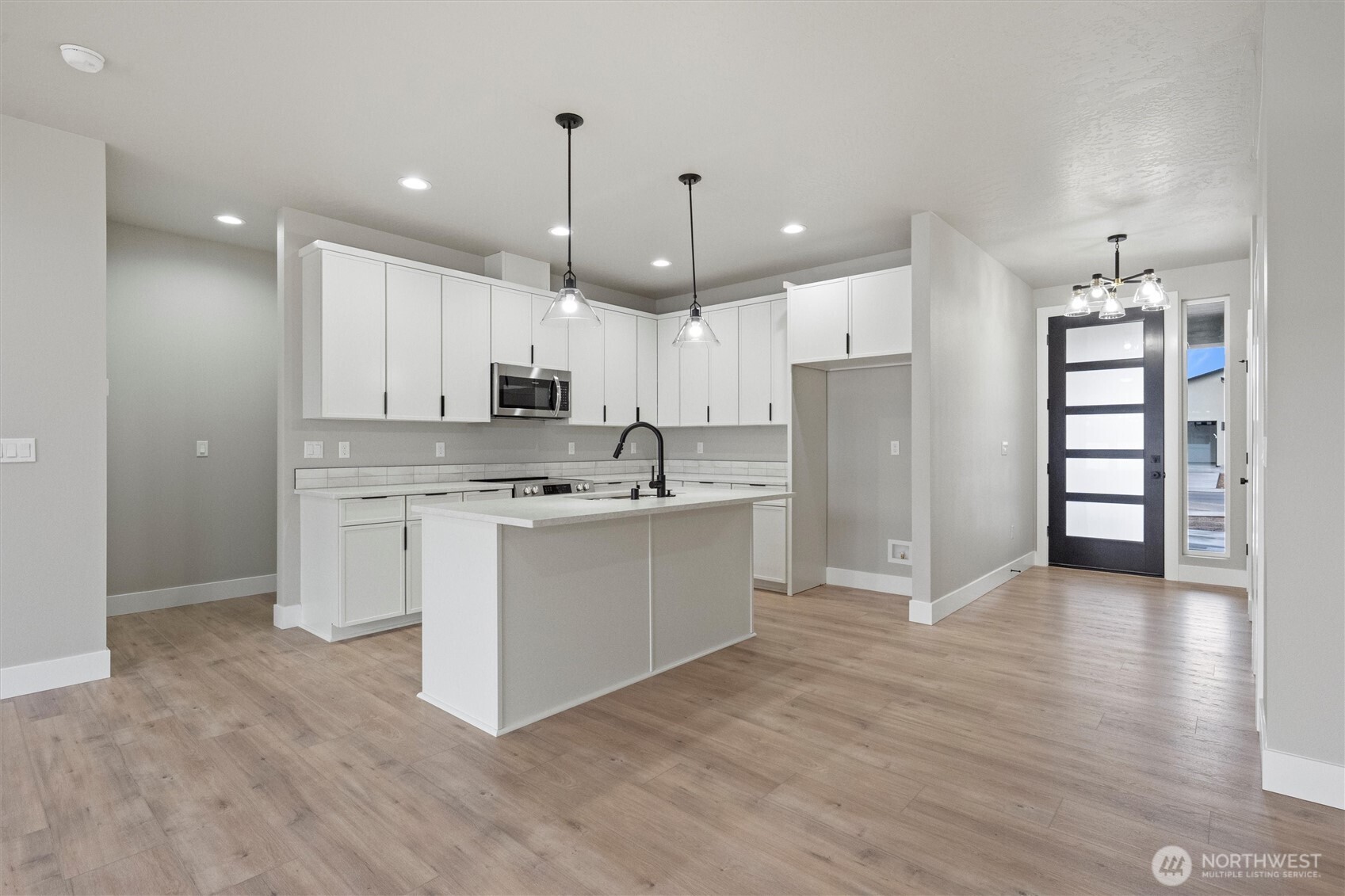 1264 E Mount Othello, WA 99344 - Photo 7 of 35 a view of kitchen with granite countertop a white stove top oven and cabinets