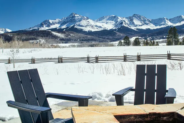 a view of a balcony with chair and table