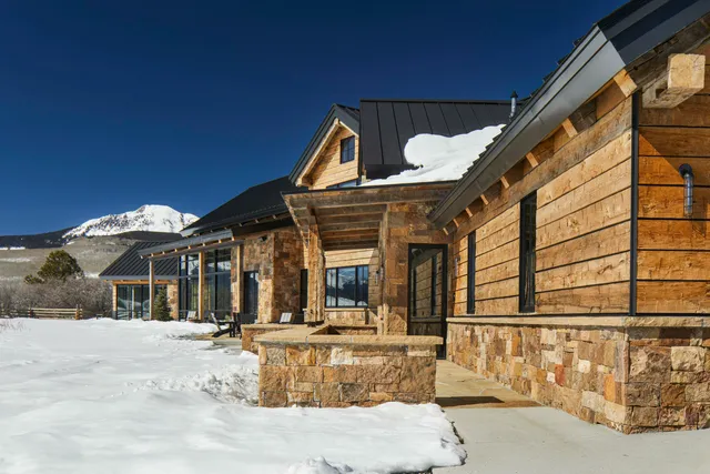 a view of a house with large windows