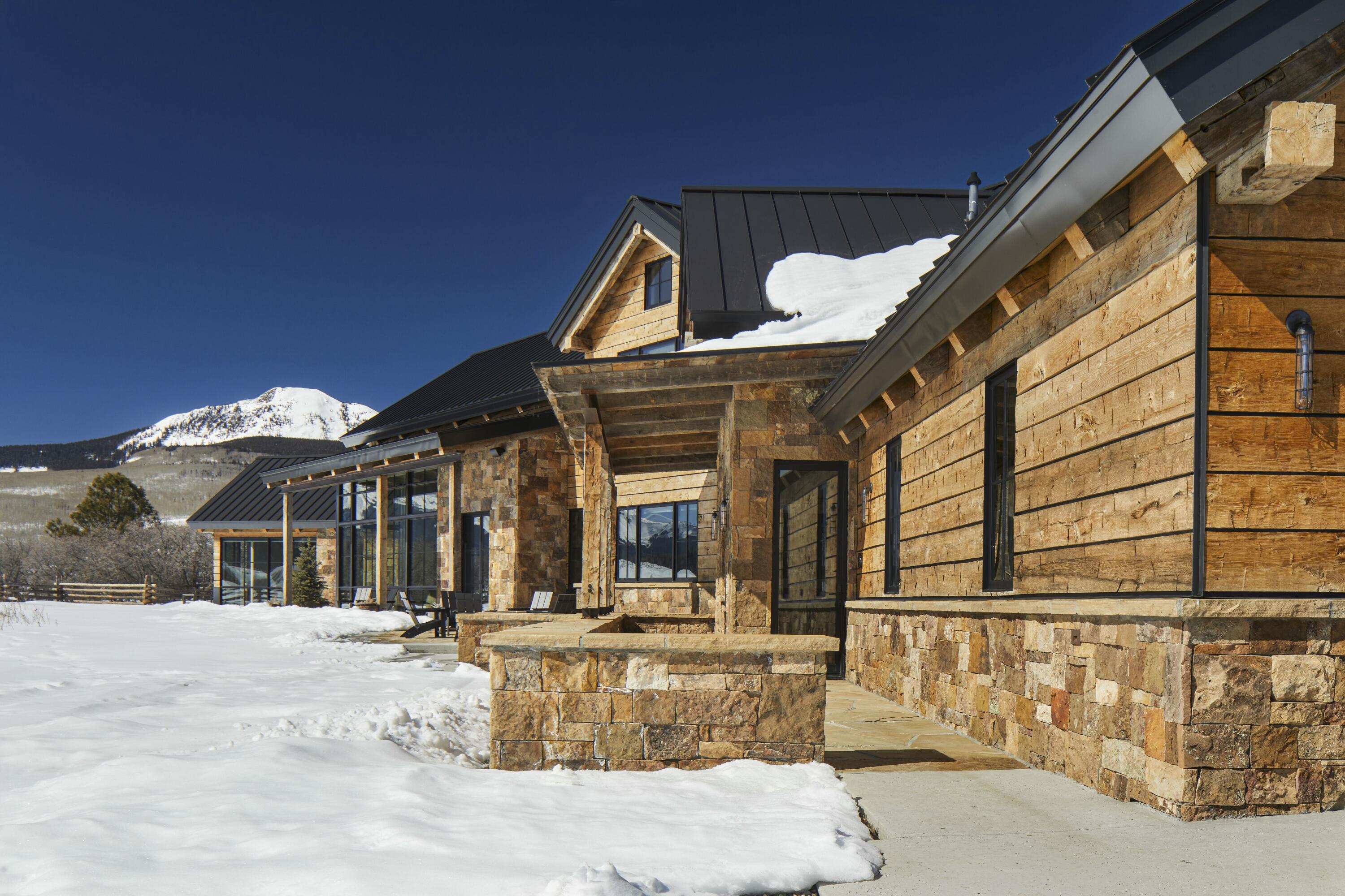 1050 / 973 Posey Road Placerville, CO 81430 - Photo 4 of 18 a view of a house with large windows