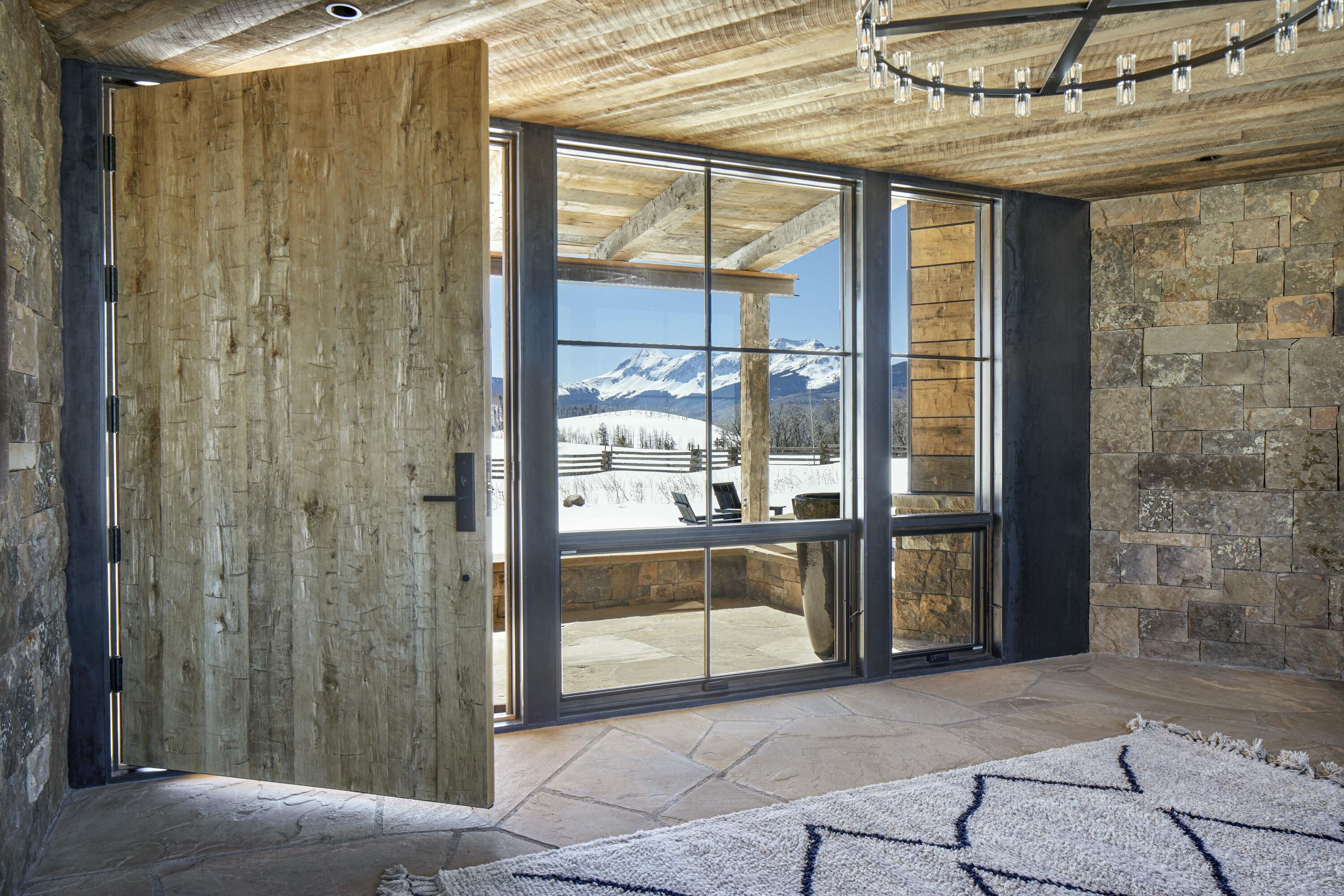 1050 / 973 Posey Road Placerville, CO 81430 - Photo 5 of 18 a view of a glass door with a glass door