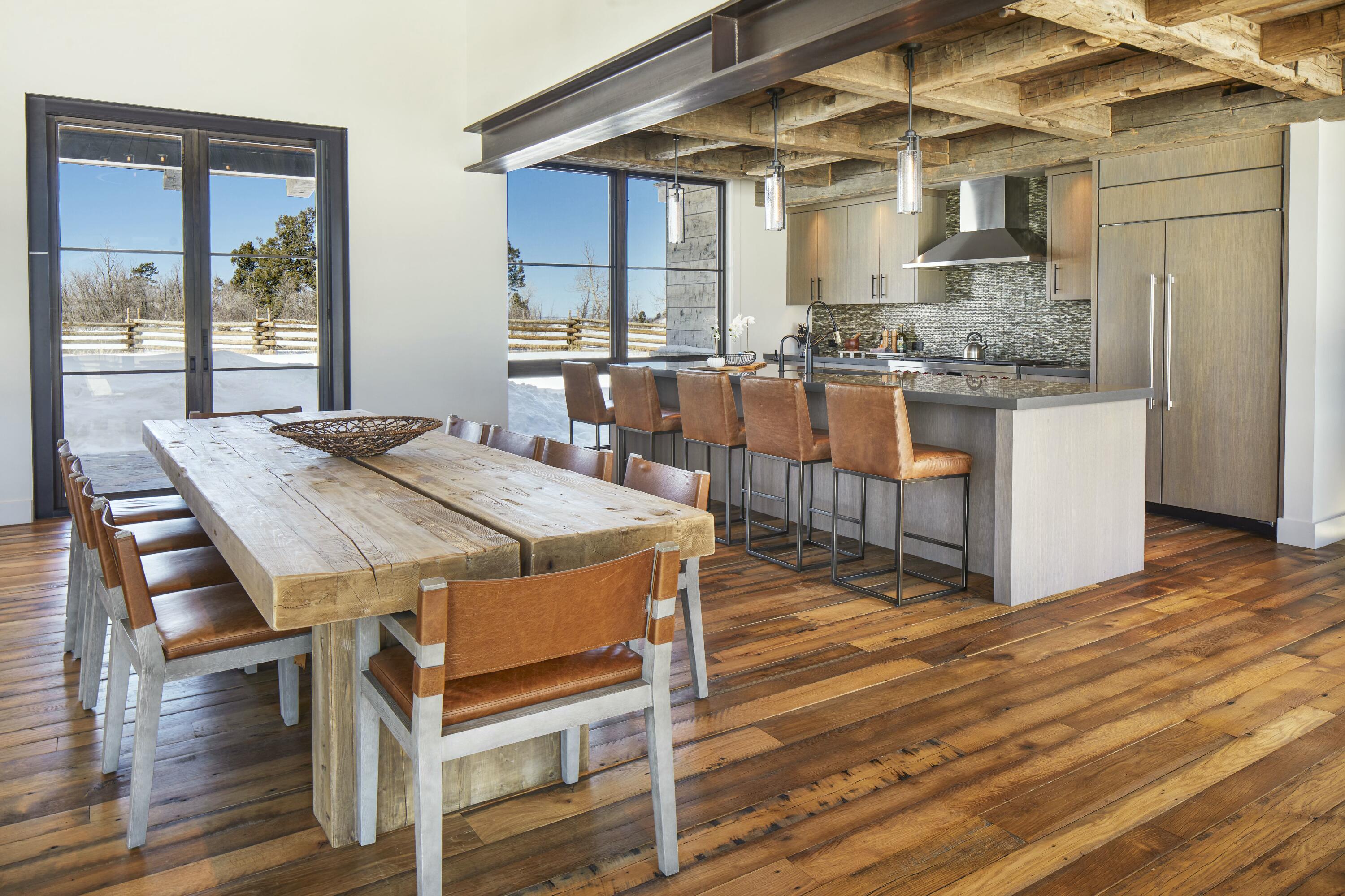 1050 / 973 Posey Road Placerville, CO 81430 - Photo 9 of 18 a view of a dining room with furniture and wooden floor