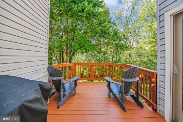 a view of a balcony with chairs