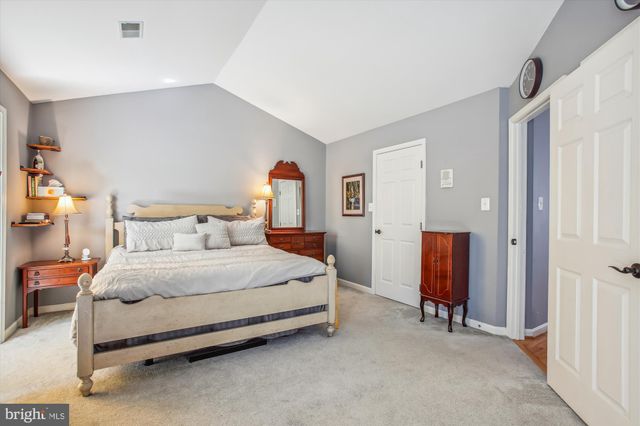 a bedroom with bed and a cabinets