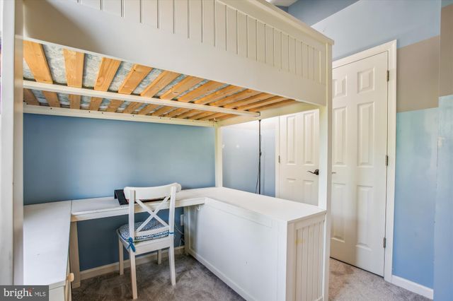 a utility room with a table and chairs