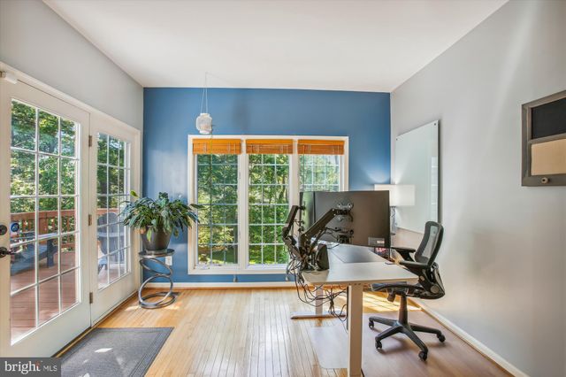 a workspace with furniture and a window