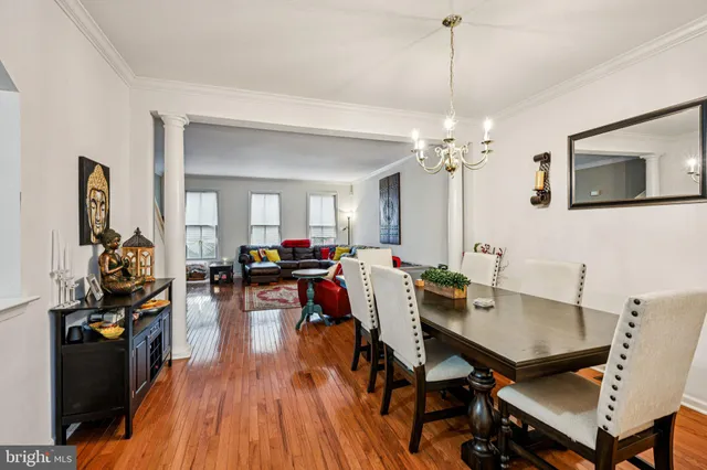 a kitchen with cabinets stainless steel appliances and a window