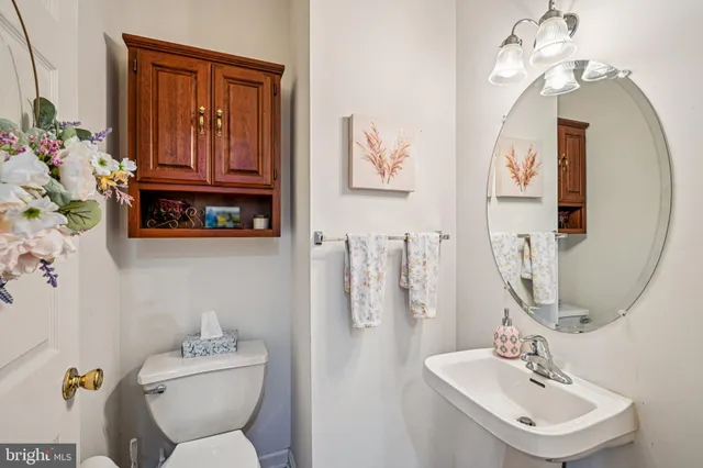 a living room with furniture and a dresser