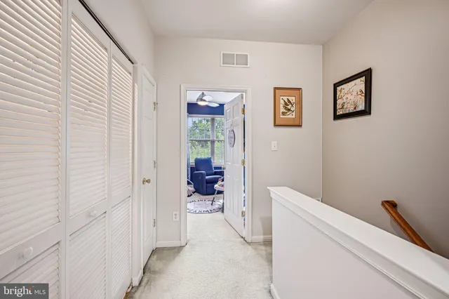 a bathroom with a sink vanity and mirror