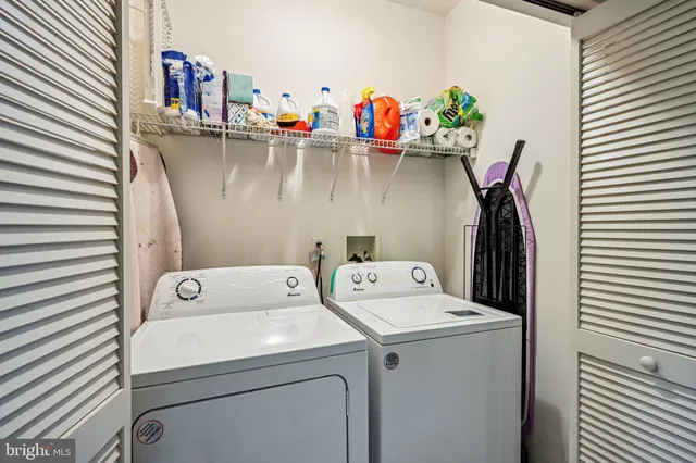 a bathroom with a toilet and a shower curtain