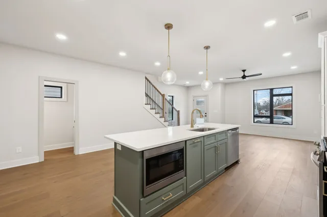 a kitchen with a stove and a sink