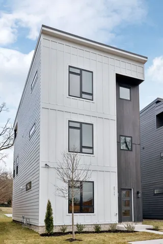 a front view of a house with stairs