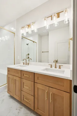 a bathroom with a sink vanity and mirror
