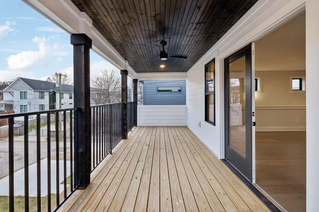 a view of a balcony with wooden floor
