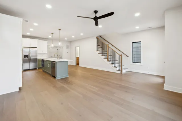 a view of kitchen with furniture and a ceiling fan