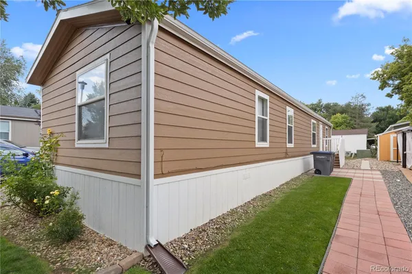 a view of house with backyard