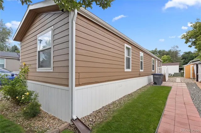 a view of house with backyard