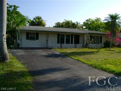 1437 Mandel Road Fort Myers, FL 33919 - Photo 1 of 8 a view of a house with backyard and sitting area
