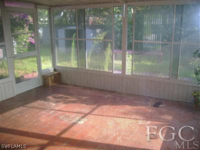 1437 Mandel Road Fort Myers, FL 33919 - Photo 7 of 8 a view of empty room with windows