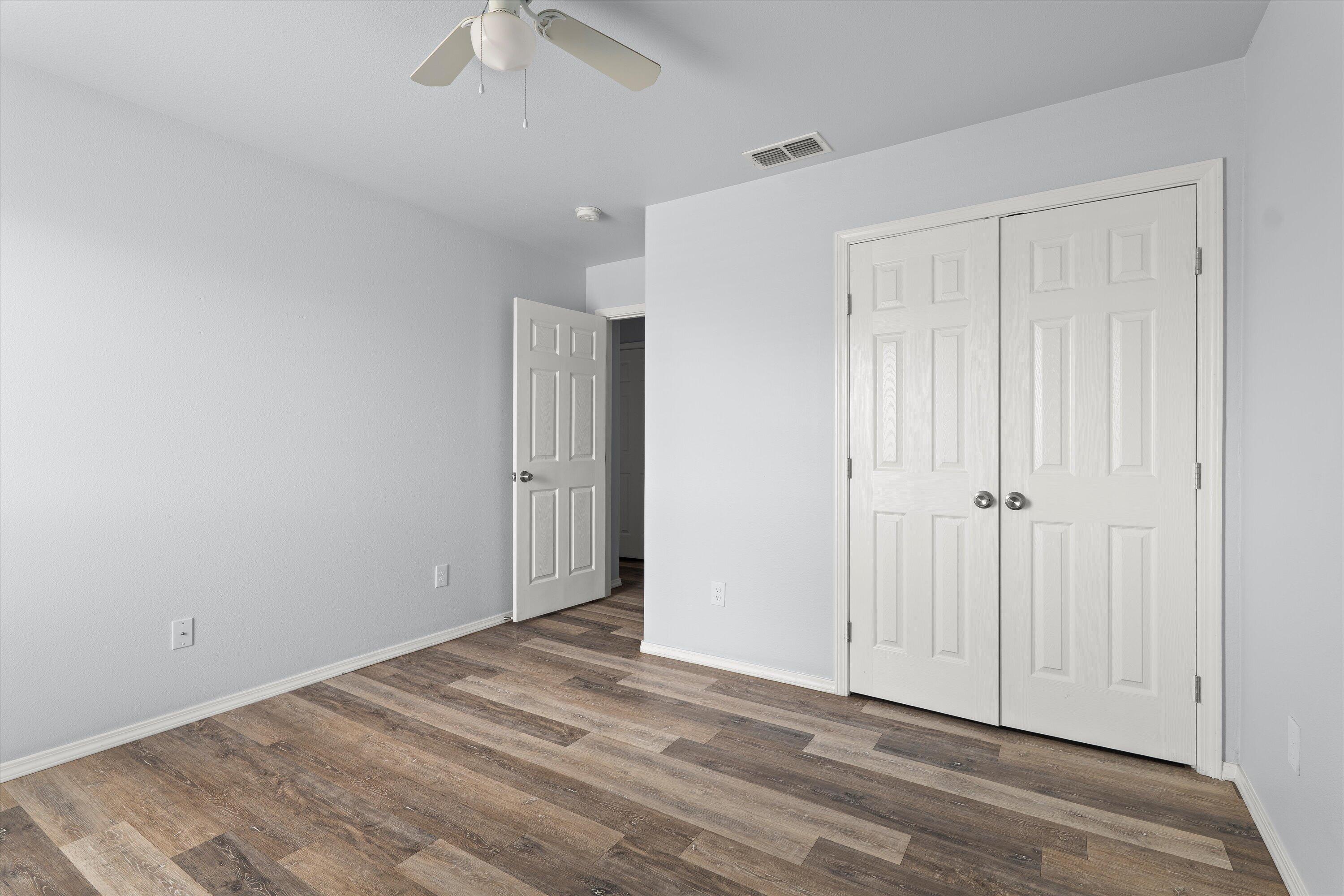8414 11th Street Lubbock, TX 79416 - Photo 19 of 26 wooden floor in an empty room