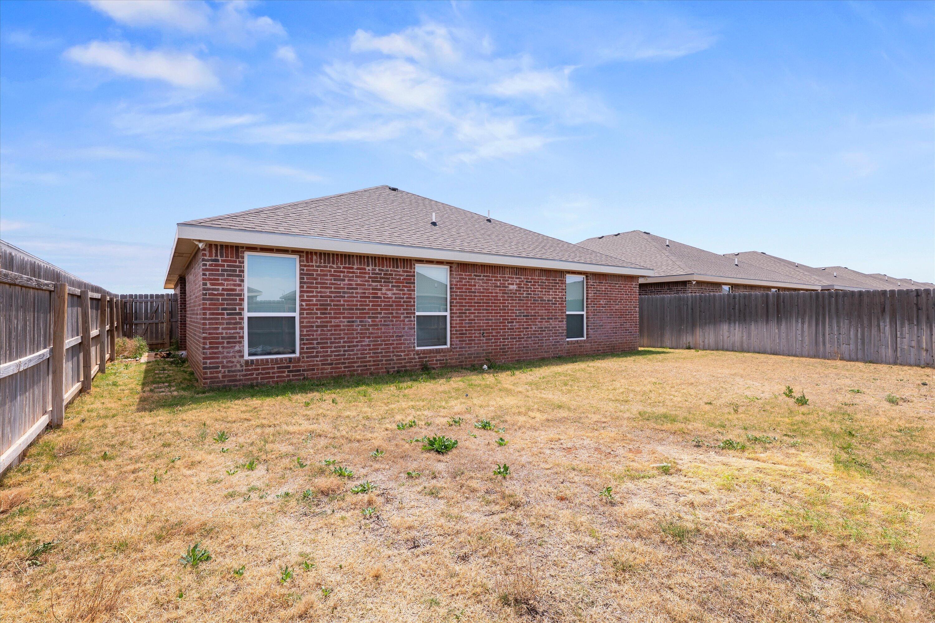 8414 11th Street Lubbock, TX 79416 - Photo 24 of 26 a backyard of a house