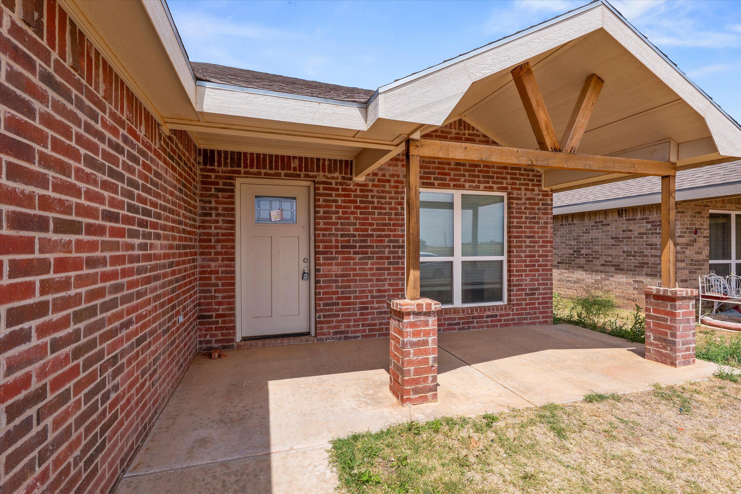 8414 11th Street Lubbock, TX 79416 - Photo 5 of 26 a view of a house with backyard and porch