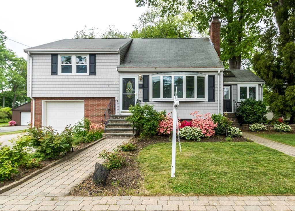 front view of a house with a yard