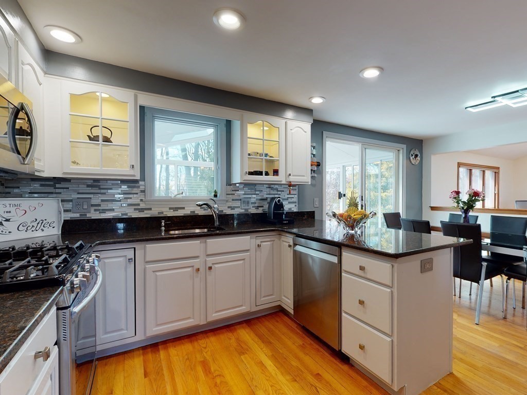 30 Kingston Road Waltham, MA 02451 - Photo 16 of 41 a kitchen with stainless steel appliances granite countertop a sink and cabinets