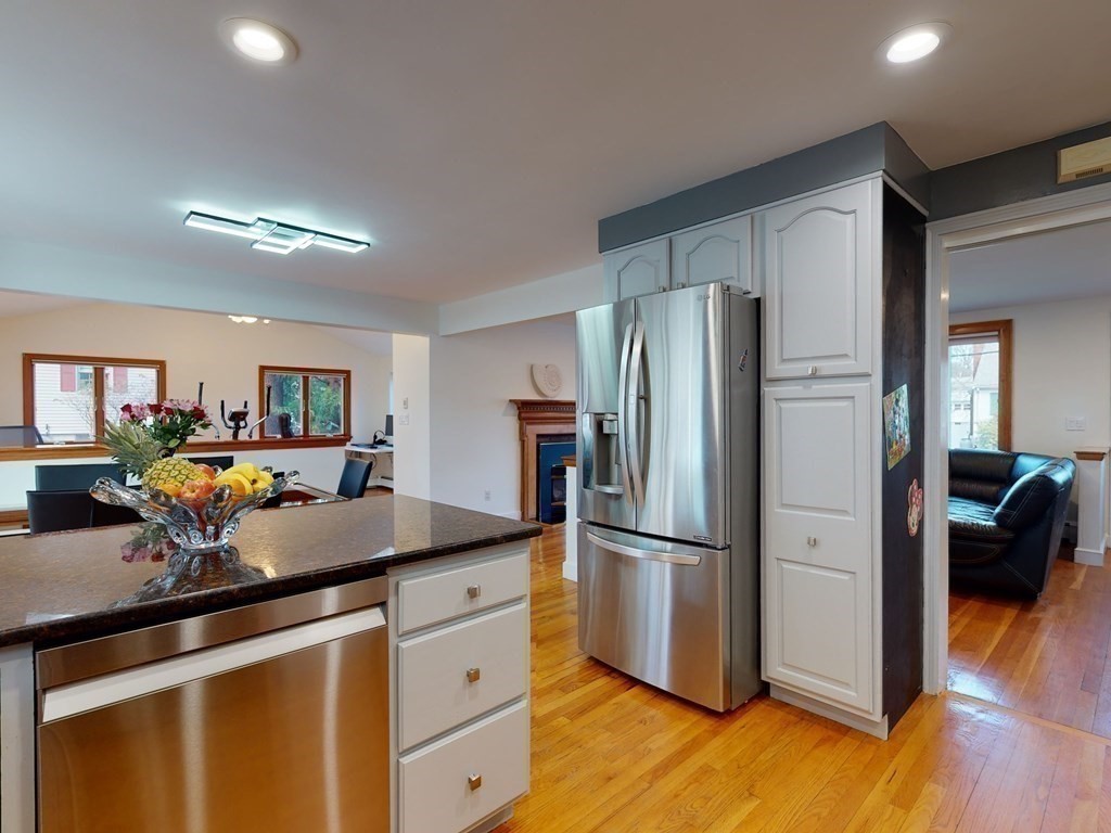 30 Kingston Road Waltham, MA 02451 - Photo 17 of 41 a kitchen with a refrigerator and a stove top oven