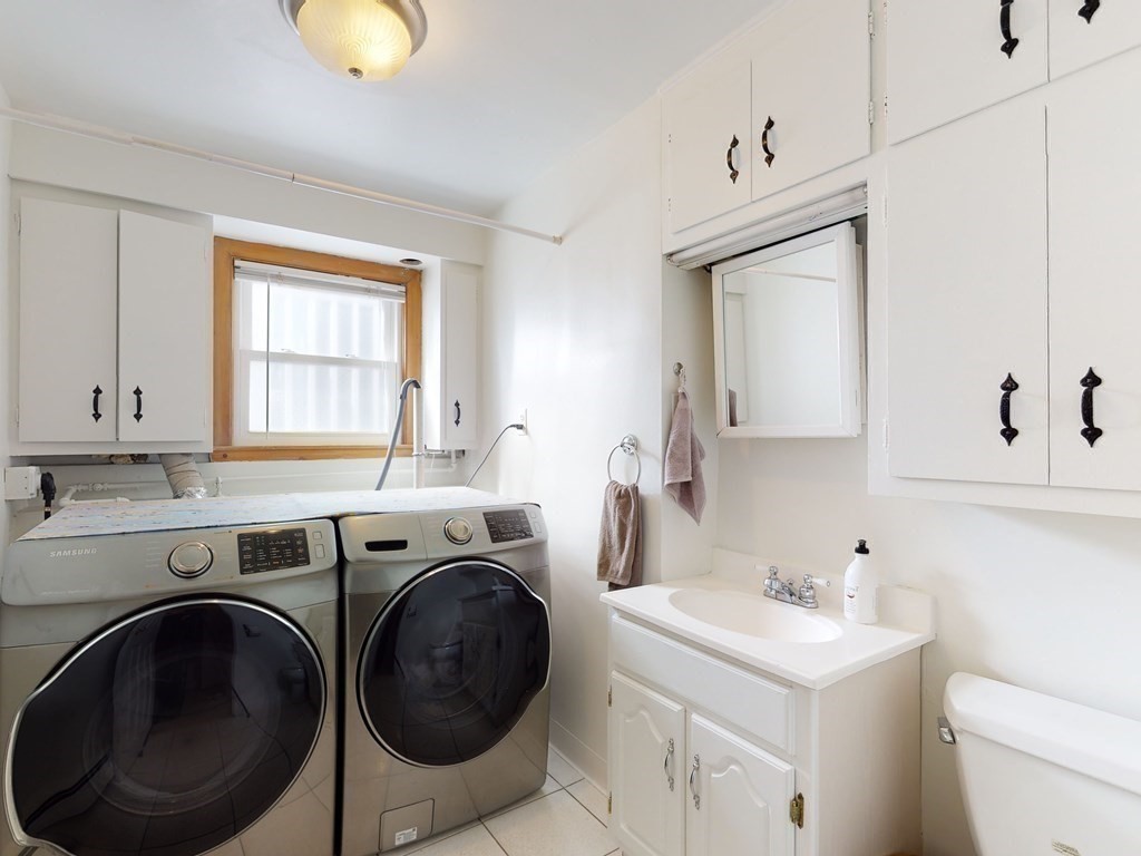 30 Kingston Road Waltham, MA 02451 - Photo 24 of 41 a view of a sink and washer dryer
