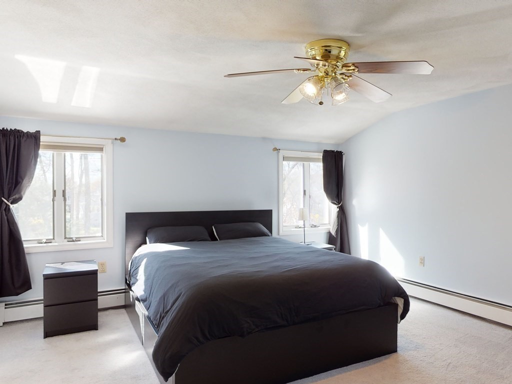 30 Kingston Road Waltham, MA 02451 - Photo 27 of 41 a bedroom with a large bed and a window